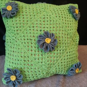 Pillow Daisies on green background knitted cover